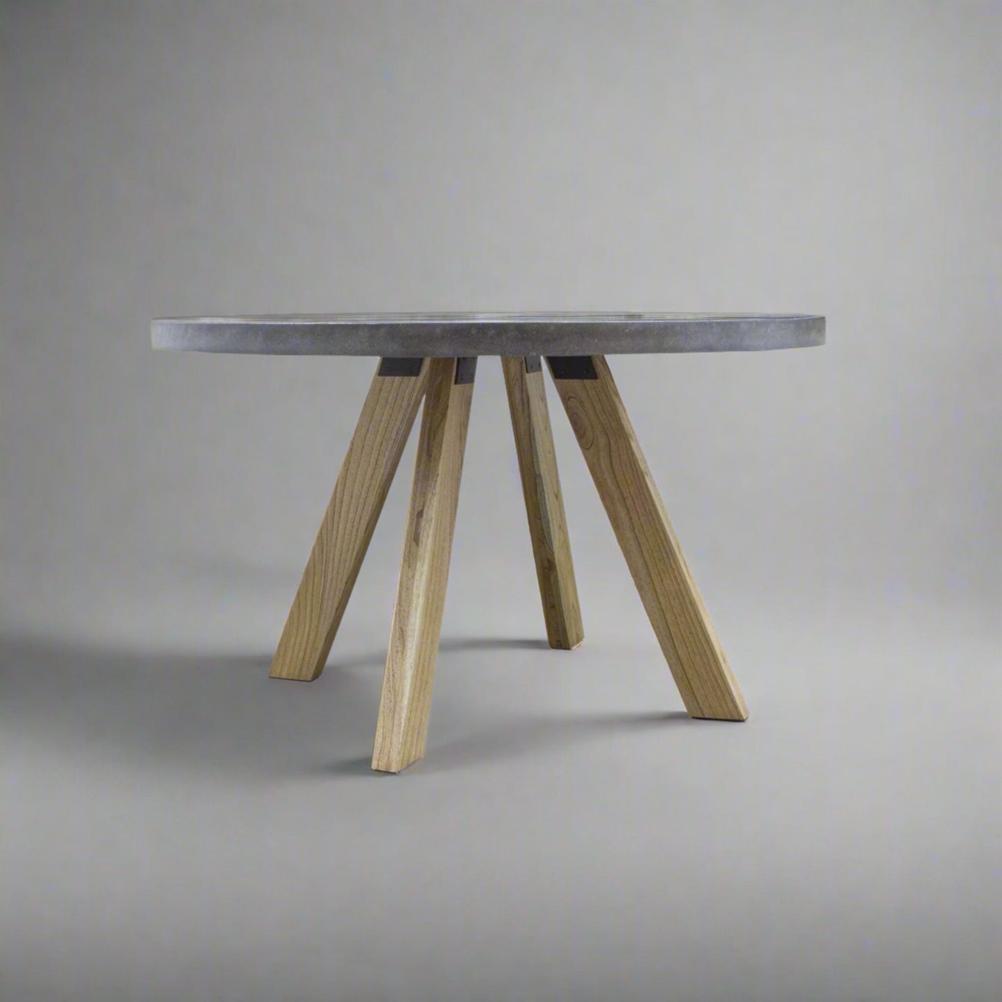 Alesund 4 Seater Small Round Dining Table Composite Grey in studio