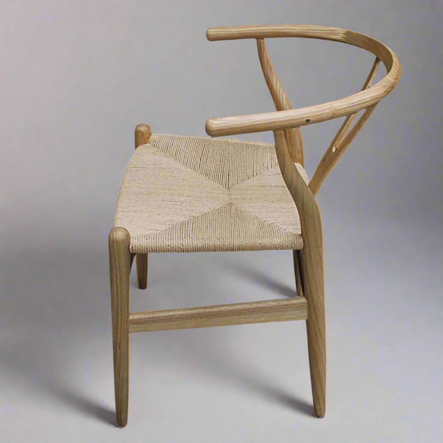 Malmo Wishbone Dining Chair With Natural Cord Seat Sungkai Wood side in studio