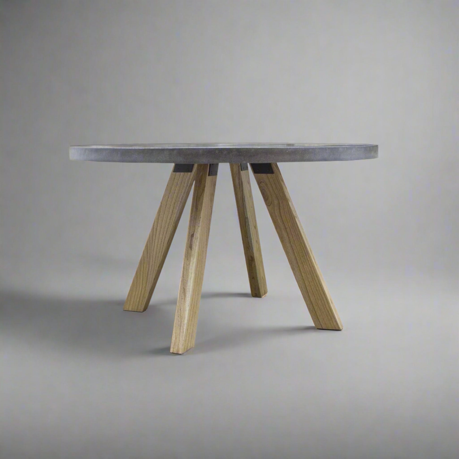 Alesund 4 Seater Small Round Dining Table Composite Grey in studio