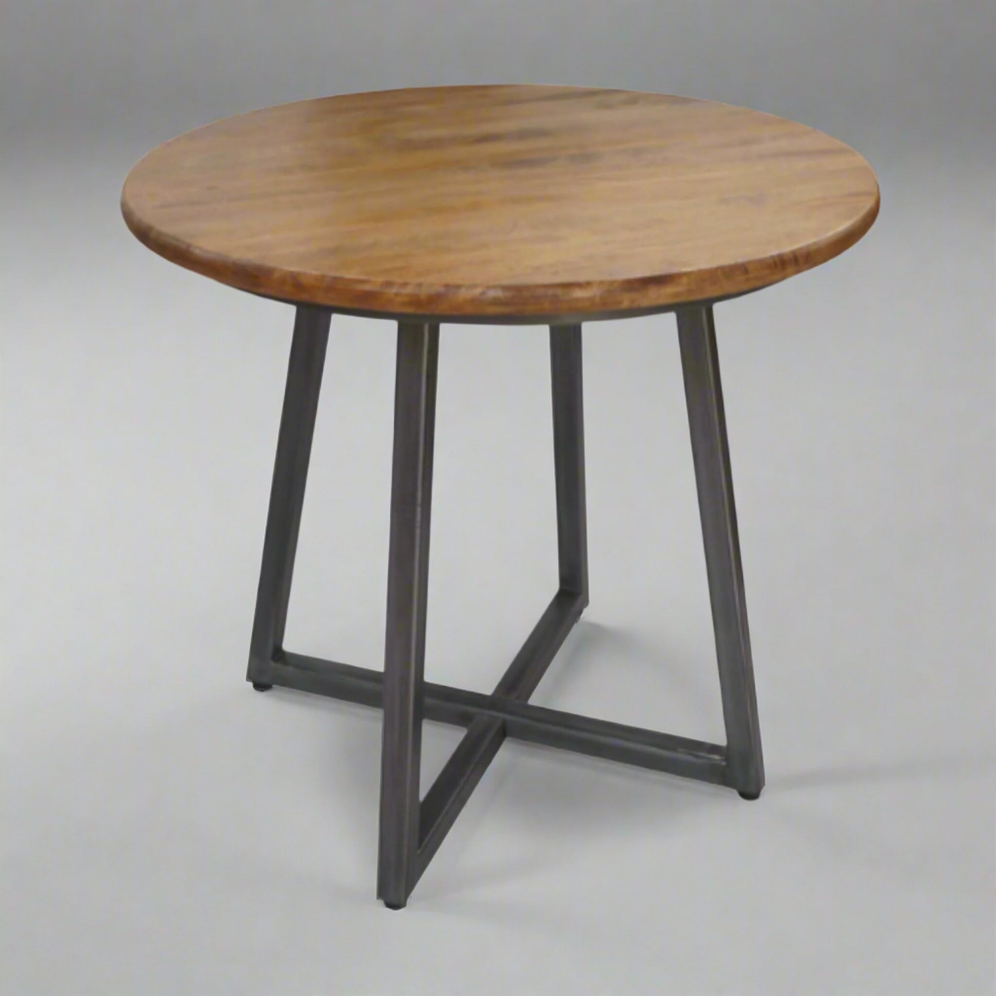 Hudson 4 Seater Round Space Saving Dining Table Mango Wood Steel in studio